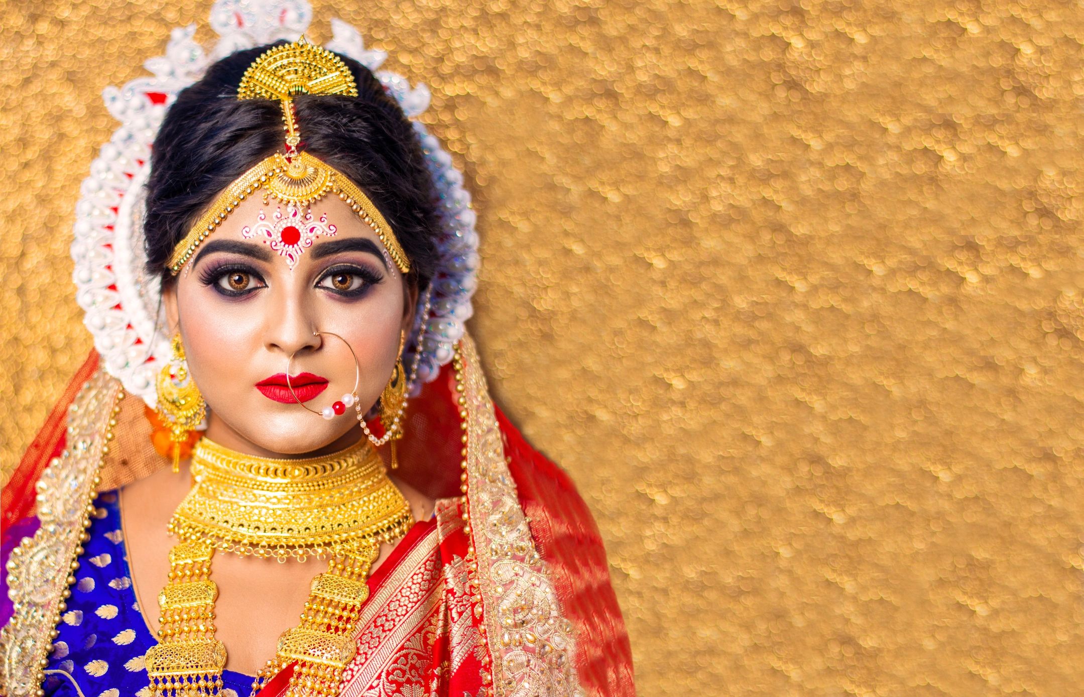 Indian bride in traditional wedding jewelry representing the brand philosophy