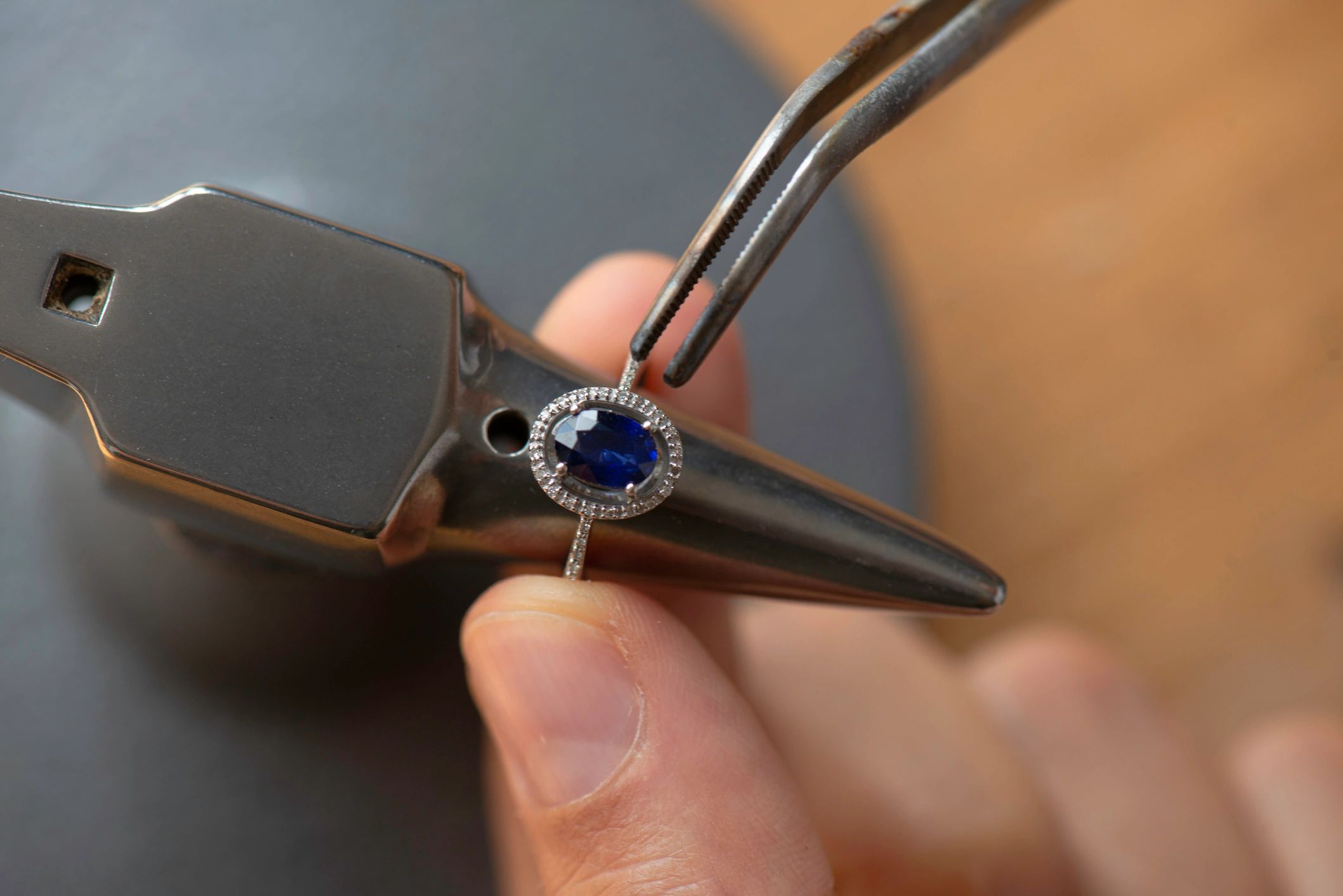 Jeweler crafting a gemstone ring by hand