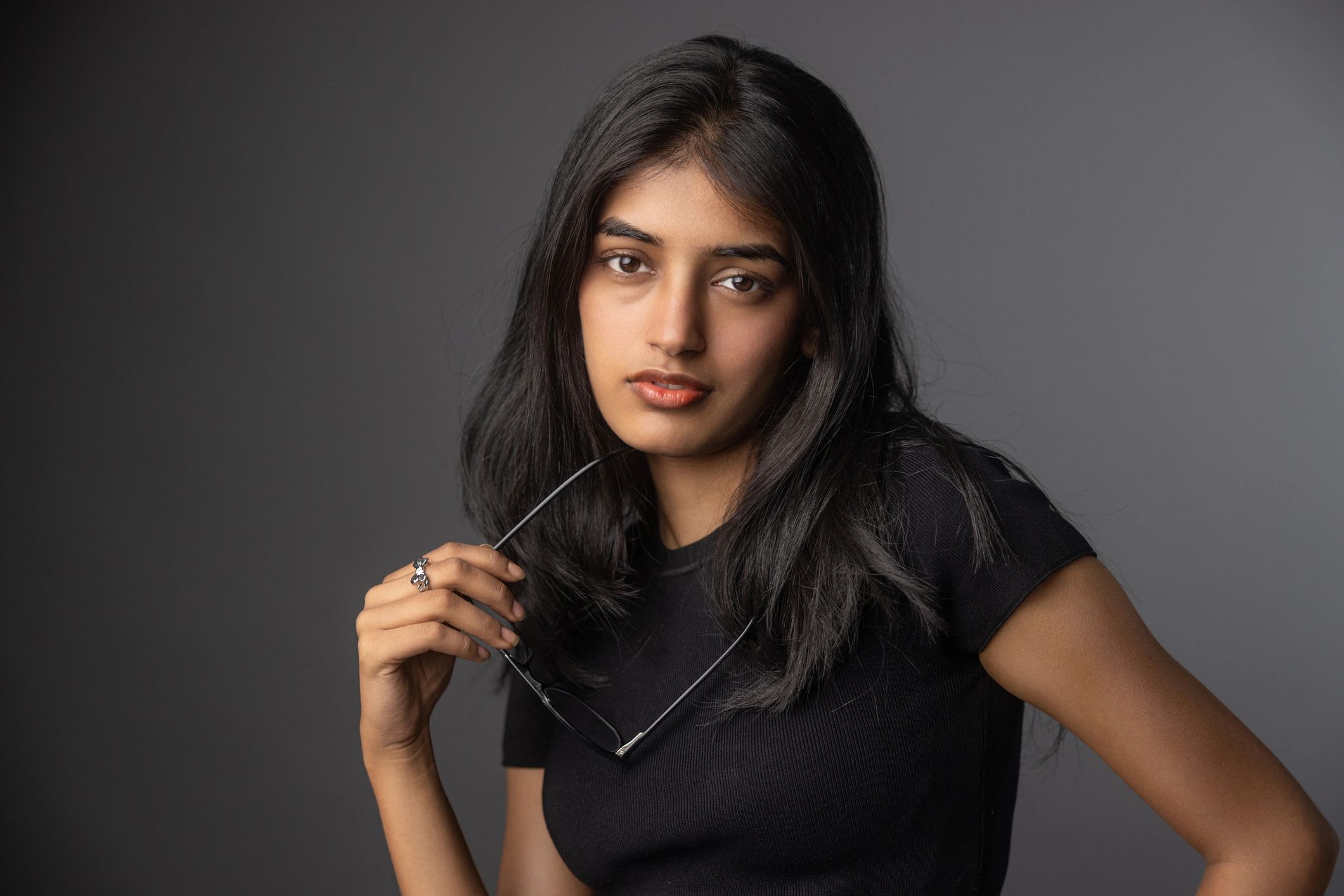 Young Indian woman in a modern look wearing contemporary jewelry