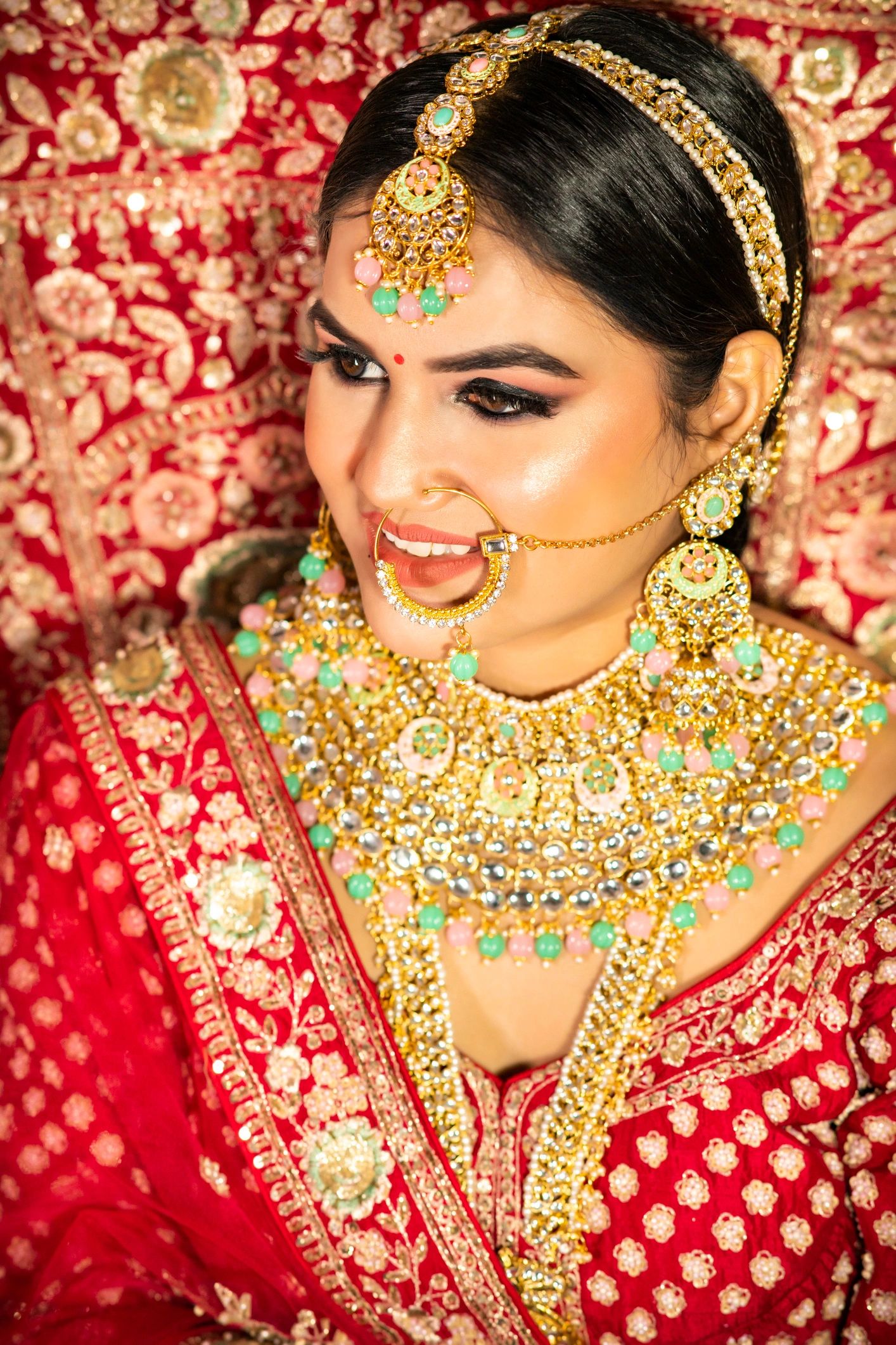 Customer portrait wearing traditional Indian bridal jewelry